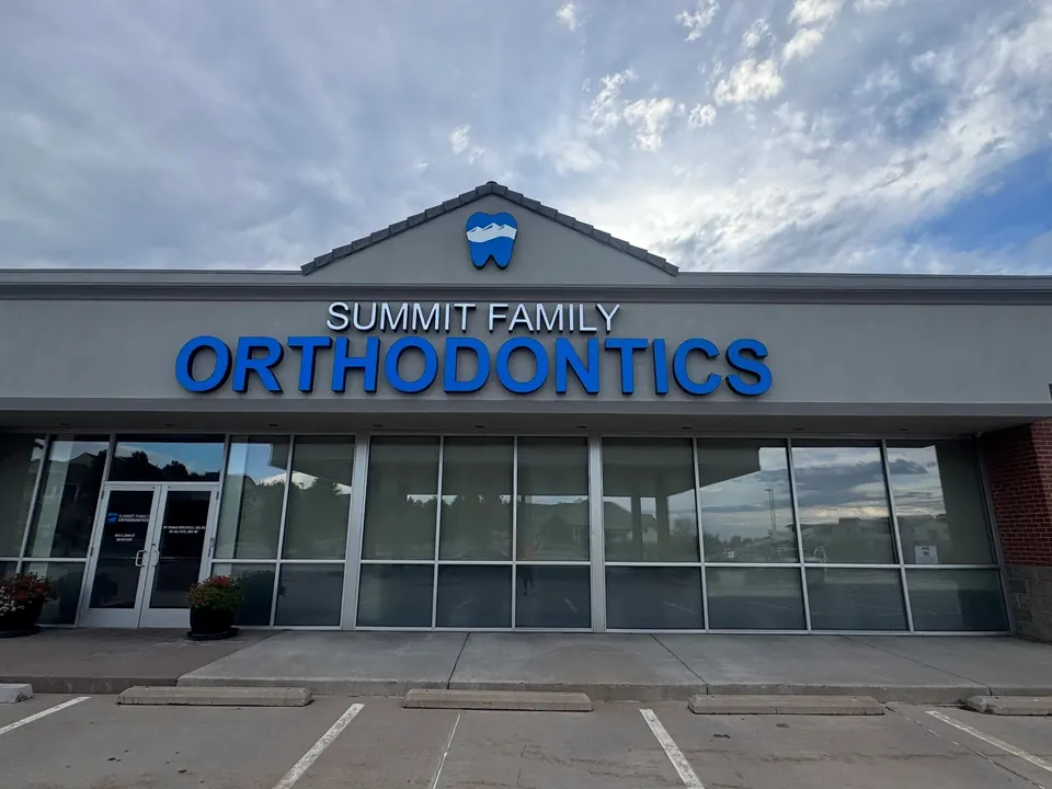 Blue channel letters reading Summit Family Orthodontics above a clinic entrance